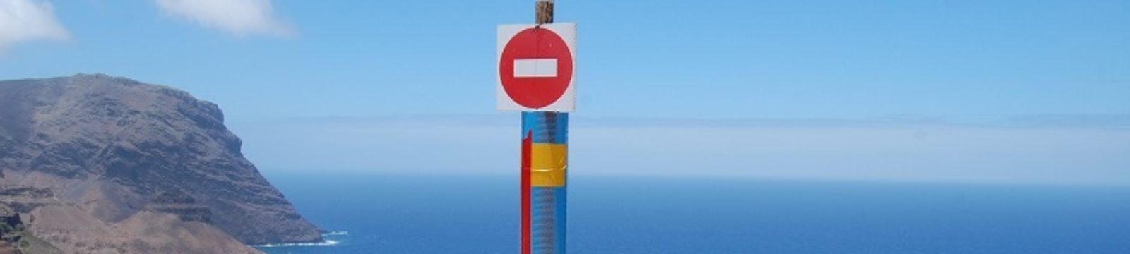 Photo of stop sign at the northern end of the runway put in place during construction of the Airport